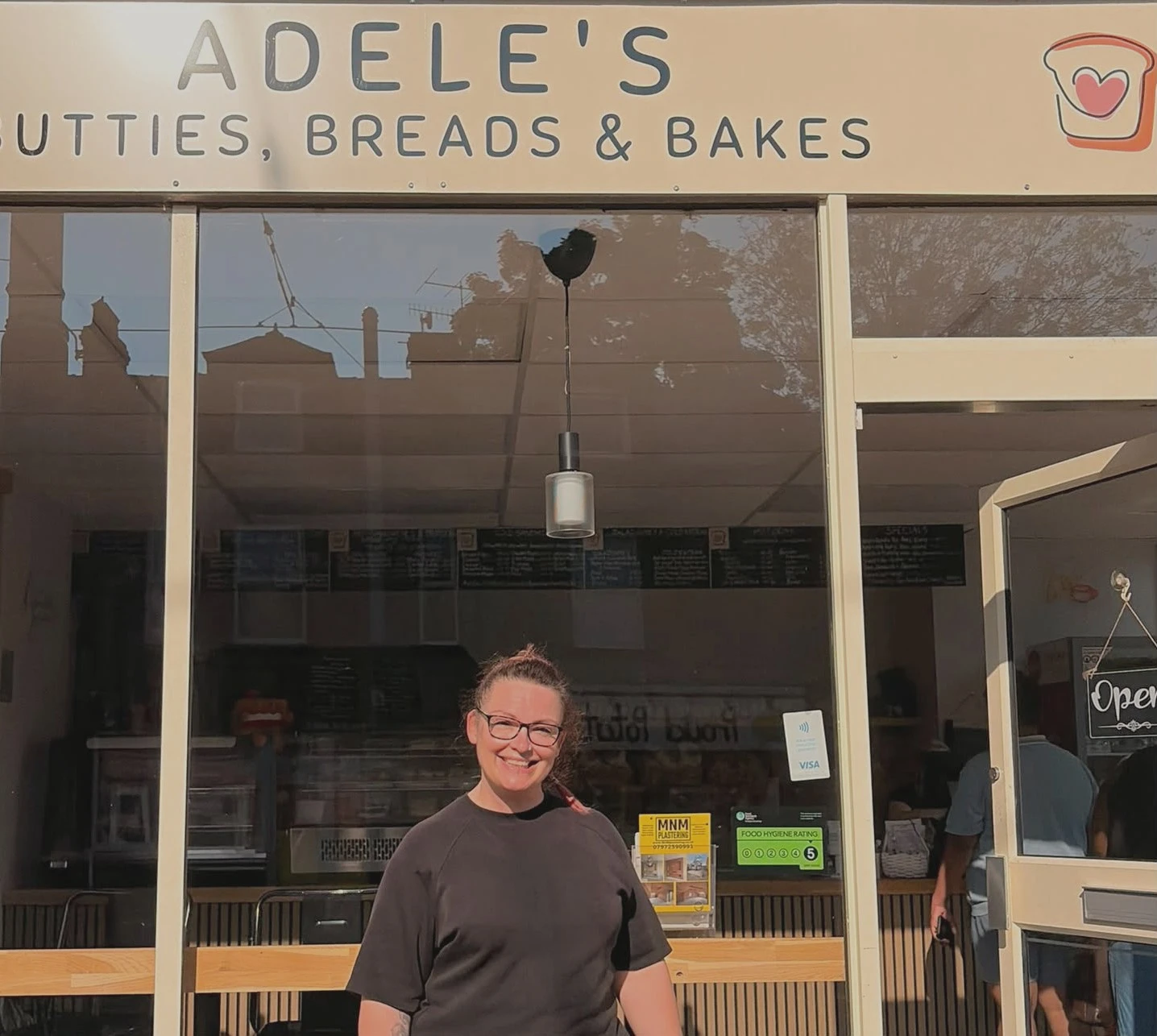 Hannah in front of the shop